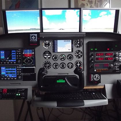 Desktop general aviation home cockpit with three monitors and analogue gauges