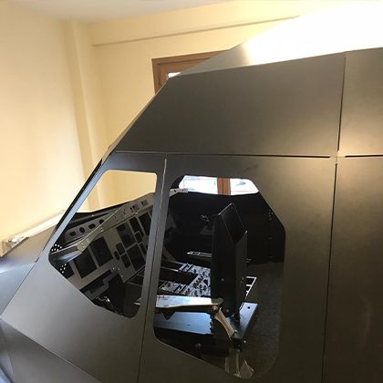 Full size simulator shell installed in a room