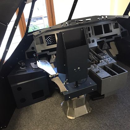 Simulator shell interior with captain side console and sidestick