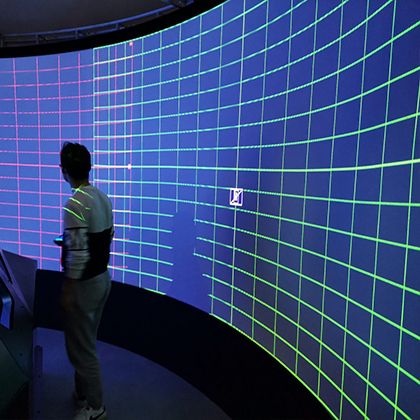 Engineer performing warp and blend calibration on a projection screen